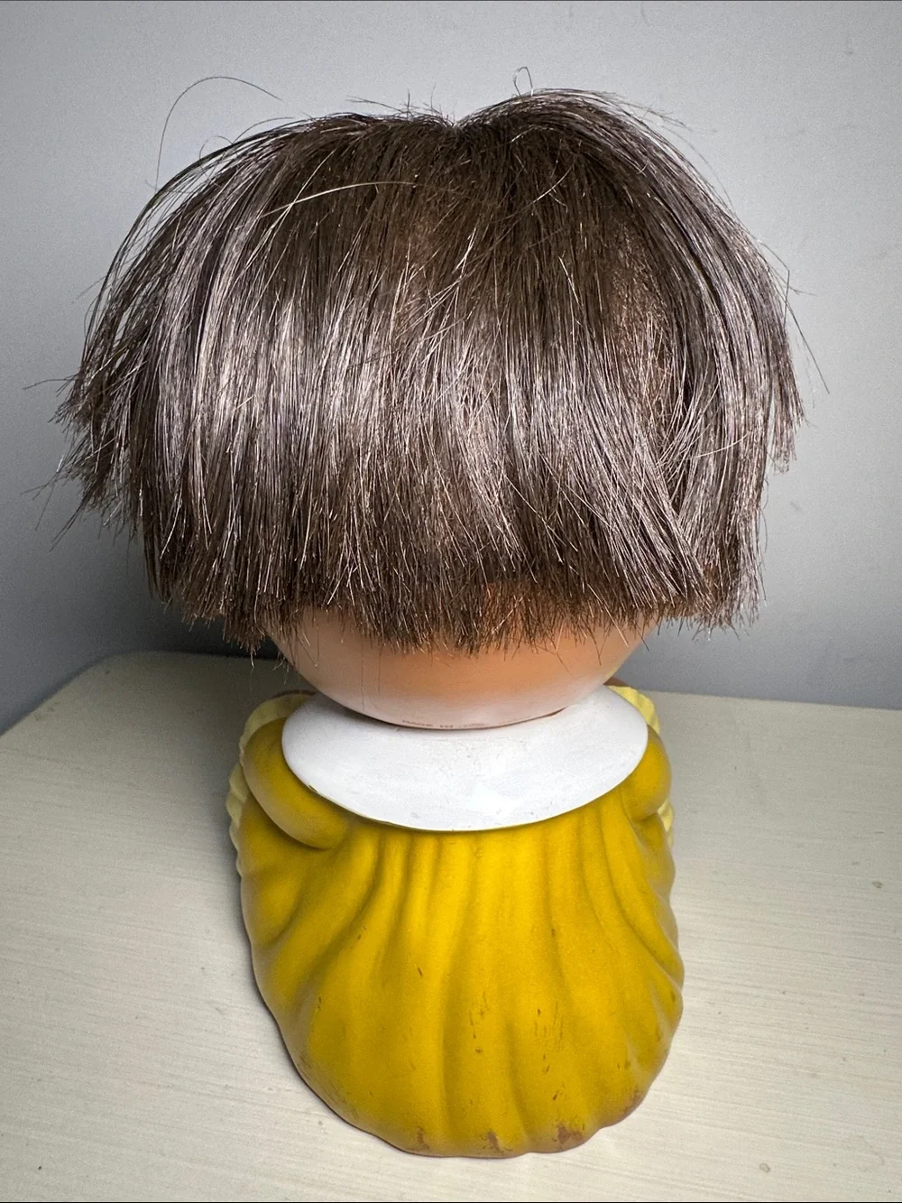 Vintage Moody Cutie grumpy Yellow Baby Doll Figure with Brown Hair Made in Japan